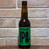 IPA blonde 33cl 4,3% – La Rombière, bouteille à étiquette verte sur fond de briques